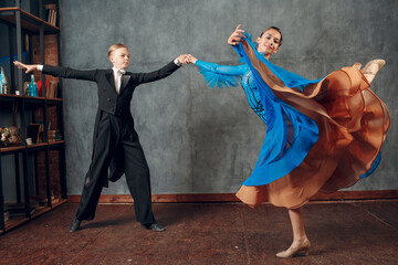 Ballroom dance. Young man and woman dancing foxtrot