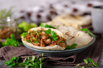 Homemade pita bread with meat and herbs