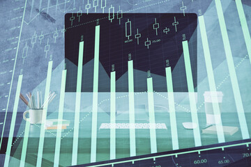 Stock market graph on background with desk and personal computer. Multi exposure. Concept of financial analysis.