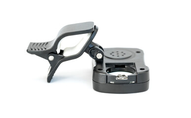 Close up view battery compartment of tuner metronome on white floor. For use the guitar sound setting.