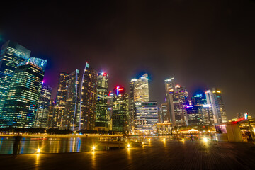 Fototapeta na wymiar Beautiful architecture building skyscraper around marina bay in singapore city at night.
