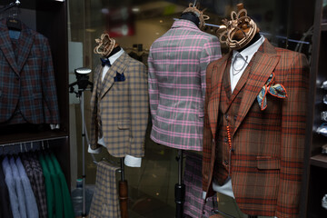 Beautiful male stylish expensive suits with bow tie on a mannequin. mannequins in the wind of a...