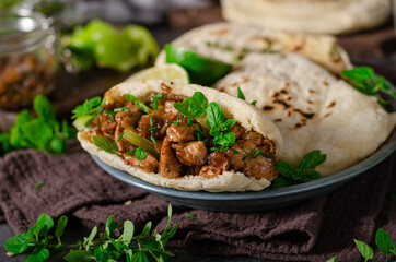 Homemade pita bread with meat and herbs