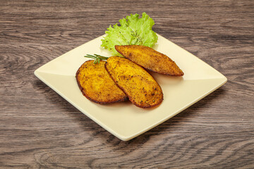Baked potato with herbs and spices