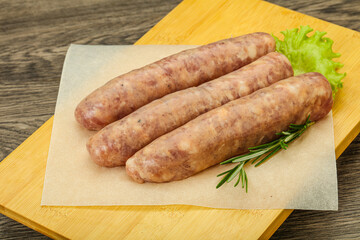 Raw pork meat sausages for grill