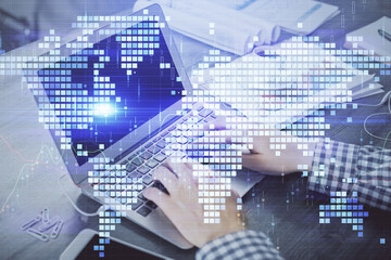 Multi exposure of businessman working on laptop on background. International business hologram in front. Concept of success.