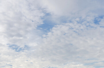 white fluffy clouds in the blue sky, Blue sky background with tiny clouds