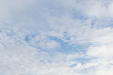 white fluffy clouds in the blue sky, Blue sky background with tiny clouds
