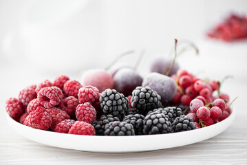 assorted frozen berries on a white plate