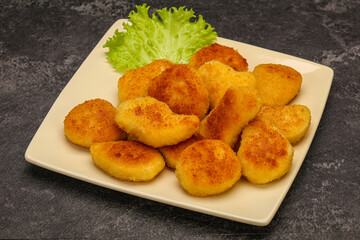 Fried chicken nuggets served salad leaves