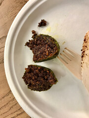 Raw Vegan Balls with Wooden Fork and Knife in Plastic Plate / Healthy Organic Vegetarian Bites.