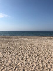 Sunny beach with blue sky