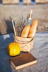Still-life. French baguette. Picnic on the beach.