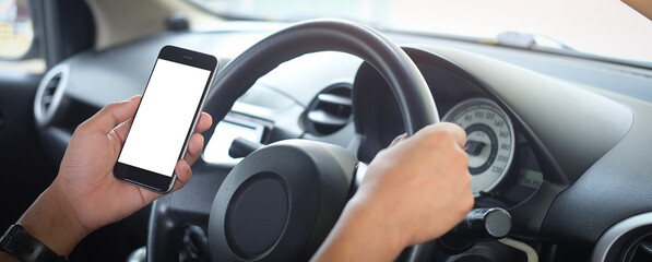 Mock up smartphone of hand holding black mobile phone with blank white screen.
