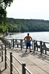 man takes sunbathing on the river