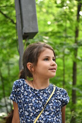 beautiful girl on a playground in a leisure park