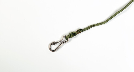 Metal carabiner with a green rope