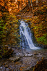 Sopit or Sopot waterfall is located in Ukrainian Carpathians at beauty autumn day. Long exposure shot.