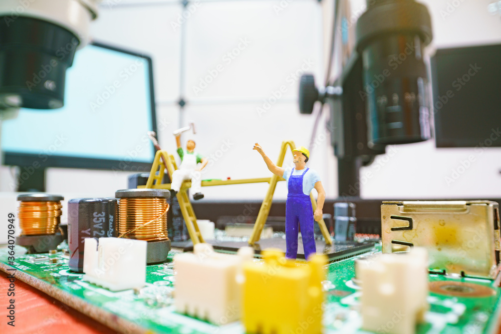 Canvas Prints Miniature repair man on mainboard, Miniature figure of worker team try to repair cpu on mainboard.