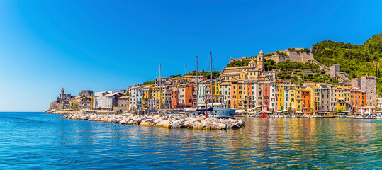 A view across the breakwater and harbour of Porto Venere, Italy in the summertime