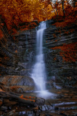 Fototapeta na wymiar Laznyi waterfall is located in Ukrainian Carpathians at the autumn times 2020. Long exposure shot.
