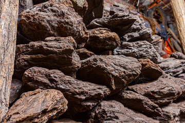 Dry charcoal pile stacked in basement