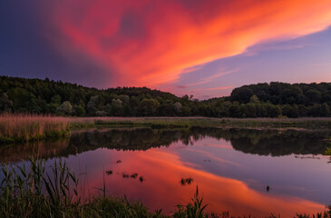 Fantastic beautiful sunset evening view on lake in Stradch, Lviv district. june 2020. Long exposure shot.