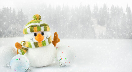 Snowman on a blue background with copy space. Christmas background. Banner.