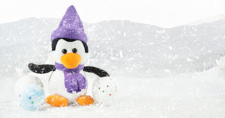 Penguin on a blue background with copy space. Christmas background. Banner.