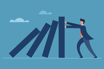 Obraz premium Business executive blocking the falling of vertical blocks