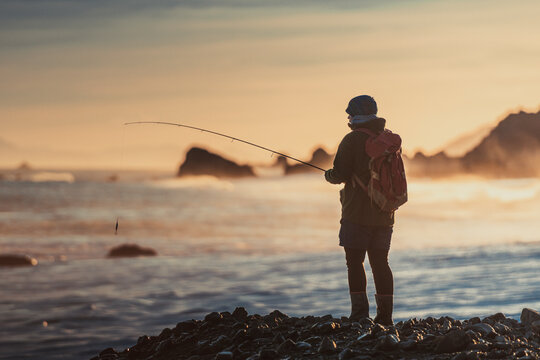 man fishing on the beach