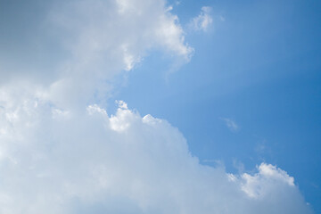 Clouds are melting and flow on blue sky. Abstract clouds against a background of blue sky