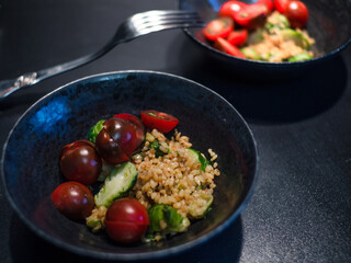 Salad with bulgur and vegetables, tomatoes and Brussels sprouts.