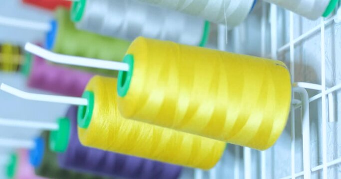 Close up many spool of colorful thread UHD 4K