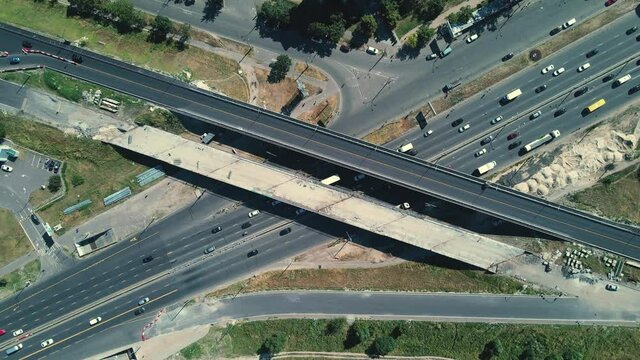 UKRAINE, KYIV - JULE 09, 2020: Aerial shot of highway reconstruction on Stepan Bandera Avenue in Kyiv. Bridge construction near the Pochayna metro station 