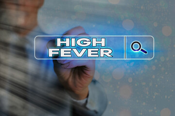 Writing note showing High Fever. Business concept for medical condition which the body temperature...