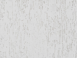 cracks and pits in white stucco on the wall - texture
