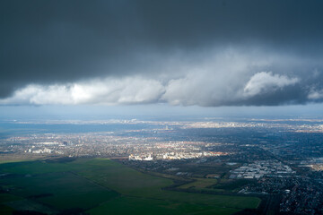 Overcast, cloud border over city. Aerial view 