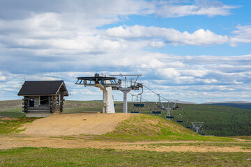Fototapeta na wymiar View of the ski lift on the top of Kaunispaa mountain, Saariselka, Lapland, Finland