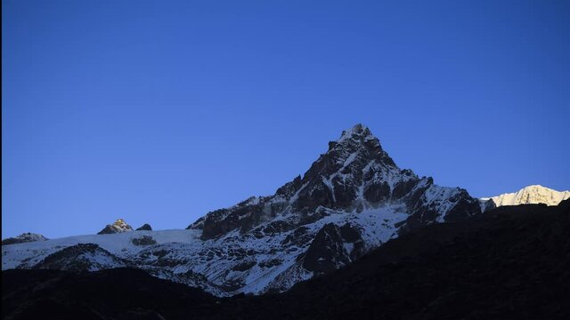 Time-lapse of Sunlight scattering through the top of Pointy Mr. Frey Peak in Eastern Himalayan Range in Sikkim at 5380m shot in 4k