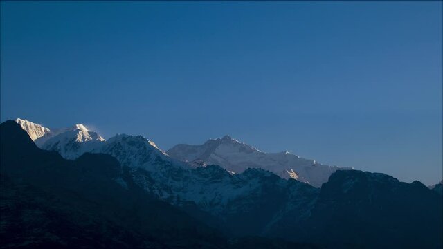 Time-lapse of Sunrise on top of the Kanchenjunga Peak, the third Highest Mountain in the world at the height of 8586m seen from Goechala Trek shot in 4k.