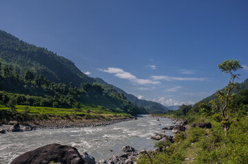 Fototapeta premium Budhi Gandaki river, a tributary of Gandaki/Narayani river as seen along Manaslu Circuit trek route from Arughat Bazar to Jagat villages, Gorkha district, Nepal Himalaya, Nepal.