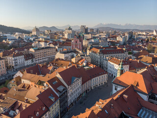 Fototapeta na wymiar Panoramic view of Ljubljana, capital of Slovenia, at sunset. Empty streets of Slovenian capital during corona virus pandemic social distancing measures in 2020.