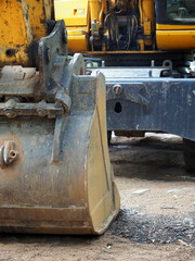 fragment of an excavator with a bucket close-up. Excavator Earthworks