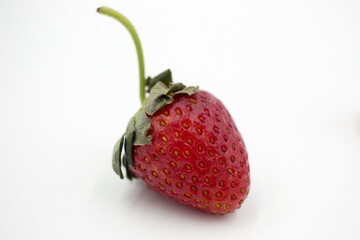 Delicious summer strawberry on a white background, close-up