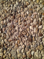 Custom masonry walls made of sand and small stones.