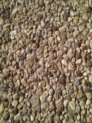 Custom masonry walls made of sand and small stones.