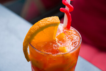 Alcoholic cocktail and lemonade with citruses