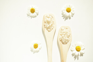 The concept of Spa treatment with salt and marigold. Natural herbal skin care products.