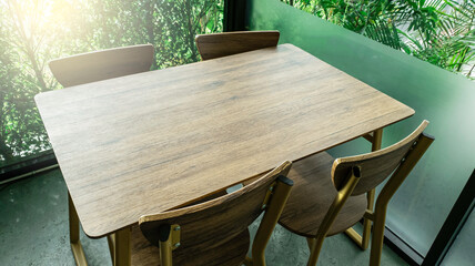 Empty wooden table in cafe restaurent, Wooden table with flare light in the morning